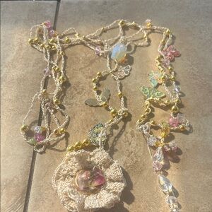 Cream Crochet Necklace with Pink Glass Flower Pendant and Gold Accents